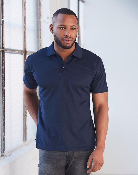 Man wearing Winning Spirit polo in navy